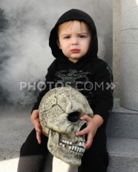 146968541-young-boy-holding-skull-photos-com.jpg